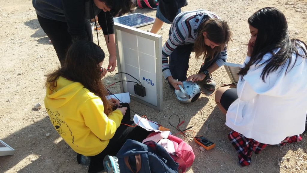 Students in Eilat-Eilot off-grid village learning about solar energy
